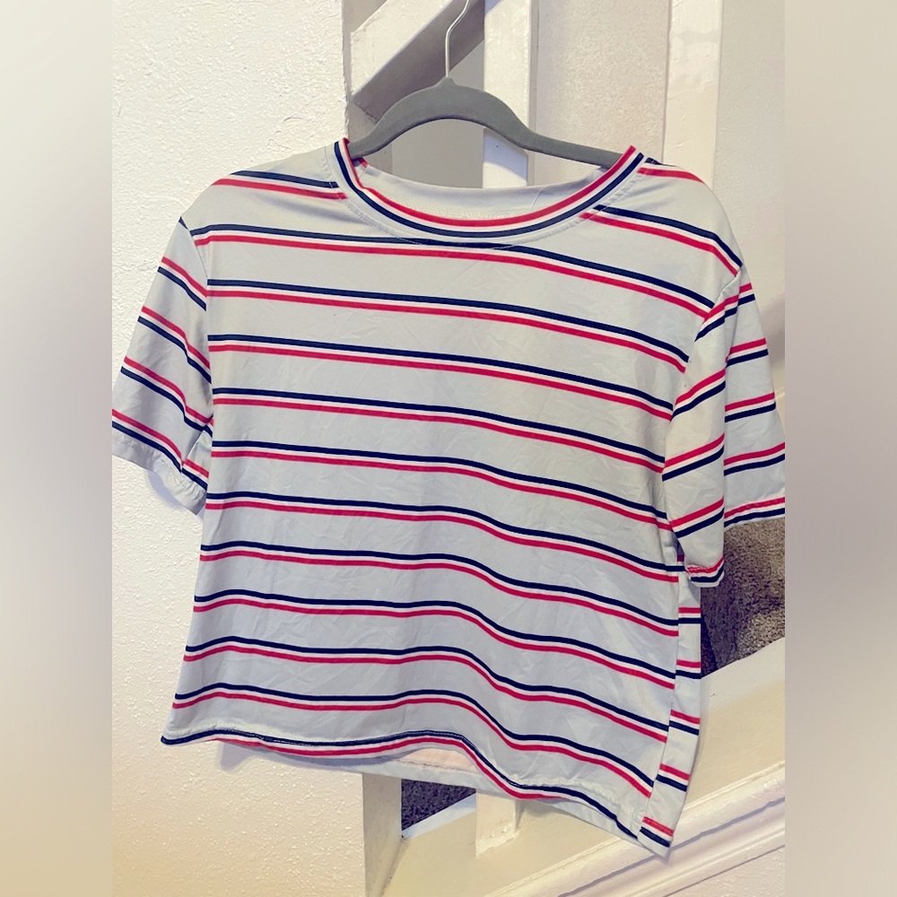 Red white and blue striped t-shirt.